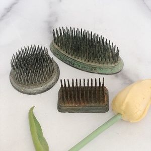 Three vintage metal flower frogs.